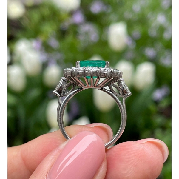 Platinum plated adjustable ring with emerald green stone and studded cz  stones -